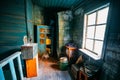 Dark and shabby messy room in poor apartment of old emergency abandoned wooden house, poverty concept Royalty Free Stock Photo
