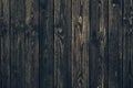 Dark shabby wooden fence with nails. Texture of black planks. Old wood brown boards. Vintage timber background. Natural pattern of Royalty Free Stock Photo