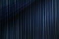 Dark shadow in blue fabric curtain in theater