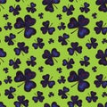 Dark shamrocks seamless pattern on a bright green background