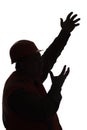 Silhouette of building contractor in hard hat waving hands on white isolated background, foreman controls work