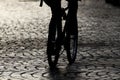 Dark silhouette of a cyclist on evening street.