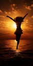 A dark silhouette of a dancing girl on the seashore against the sunset Royalty Free Stock Photo