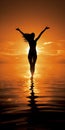 A dark silhouette of a dancing girl on the seashore against the sunset Royalty Free Stock Photo