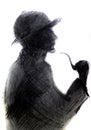 Dark silhouette of man with a pipe. Illustration of the image of Sherlock Holmes