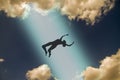 The dark silhouette of the soul of a deceased person ascends to heaven against a background of clouds. Afterlife, the concept of