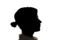 Dark silhouette of a young girl on white background, the concept of anonymity