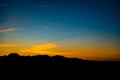Dark silhouettes of the mountains against the sky at sunset. A typical sunset landscape of the Andalusia, Spain Royalty Free Stock Photo