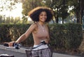 Young and positive afro american girl in casual cloth smiles sweetly and has a fun Royalty Free Stock Photo