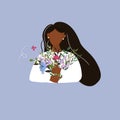 Dark-skinned girl with a long black hair holding a colourful bouquet. Romantic concept.