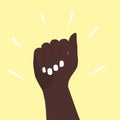 The dark-skinned hand is raised up. The hand is clenched into fist in protest. A symbol of the African, African American peace Royalty Free Stock Photo
