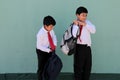 Dark-skinned Latino boys carry their backpacks and walk back to school to study and learn Royalty Free Stock Photo
