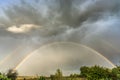 Dark sky with double rainbow