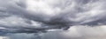 The dark sky with heavy clouds converging and a violent storm before the rain.Bad or moody weather sky and environment. carbon Royalty Free Stock Photo