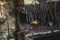 Dark smithy with blacksmith tools Royalty Free Stock Photo