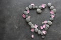 Dark Spa background with pebbles and flowers Royalty Free Stock Photo