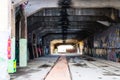 A dark, spooky tunnel in an Industrial Ruin