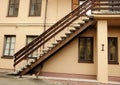 Dark stairway up on beige wall european architecture building