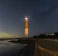 Dark starry night sky over Barnegat Lighthouse on the Jersey shore.