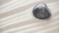 Dark stone on sand, natural background Royalty Free Stock Photo