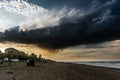 Dark storm cloud over the beach Royalty Free Stock Photo