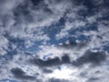 Dark storm clouds on a bright blue sky sunshine background Royalty Free Stock Photo