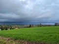 Dark storm clouds gather over a village Royalty Free Stock Photo