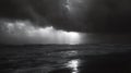 Storm clouds moving over ocean with sunlight piercing through rain creating a dramatic scene on the beach Royalty Free Stock Photo