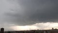 Dark storm clouds are moving over the city. raining whether