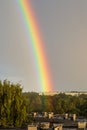 dark storm clouds over city with rainbow Royalty Free Stock Photo