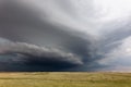 Dark storm clouds over a field in Montana Royalty Free Stock Photo
