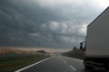 Dark storm clouds over the highway. Royalty Free Stock Photo