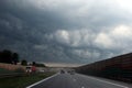 Dark storm clouds over the highway. Royalty Free Stock Photo