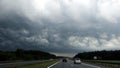 Dark storm clouds over the highway. Royalty Free Stock Photo