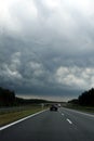 Dark storm clouds over the highway. Royalty Free Stock Photo