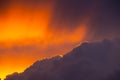 Dark storm clouds during sunset with dramatic sky and vibrant colors Royalty Free Stock Photo