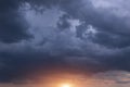 Dark Storm Cumulus Clouds With Yellow Orange Sun And Sunlight On Sunset, Sunrise