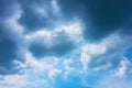 Dark storm raining clouds over blue sky on nature background. Gray cumulus clouds against on the blue sky Royalty Free Stock Photo