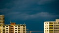 Dark storm sky behind city buildings Royalty Free Stock Photo