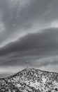 Dark stormy clouds over mountain peak with antenna Royalty Free Stock Photo