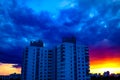 Dark stormy clouds over town, stormy weather, powerful rainstorm hits town