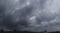 Dark stormy clouds on the sky, with striking lightning and heavy rain. Royalty Free Stock Photo