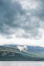 Dark stormy clouds under hill. Dramatic background Royalty Free Stock Photo