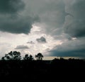 Dark stormy rain clouds over the city, landscape photography, rainy season weather conditions Royalty Free Stock Photo