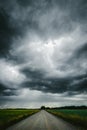 Dark stormy sky above the country road Royalty Free Stock Photo