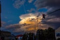 Dark stormy sky and big yellow cumulus cloud over street Royalty Free Stock Photo