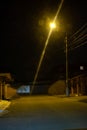 Dark street, a lantern on an old brick wall, a large moon, smoke, smog. Royalty Free Stock Photo
