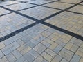 Dark street tiles that intersect with light ones