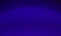 Dark studio background illuminated with blue light in the dark. An empty scene illuminated by a blue neon spotlight Royalty Free Stock Photo