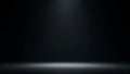 Dark Studio Background with Soft Spotlight and Illuminated Floor Edge Keywords: dark, studio, background, spotlight Royalty Free Stock Photo